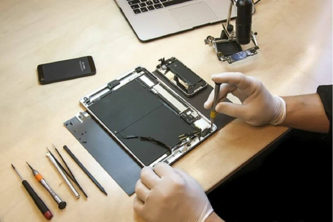 Technician working on a tablet, close-up