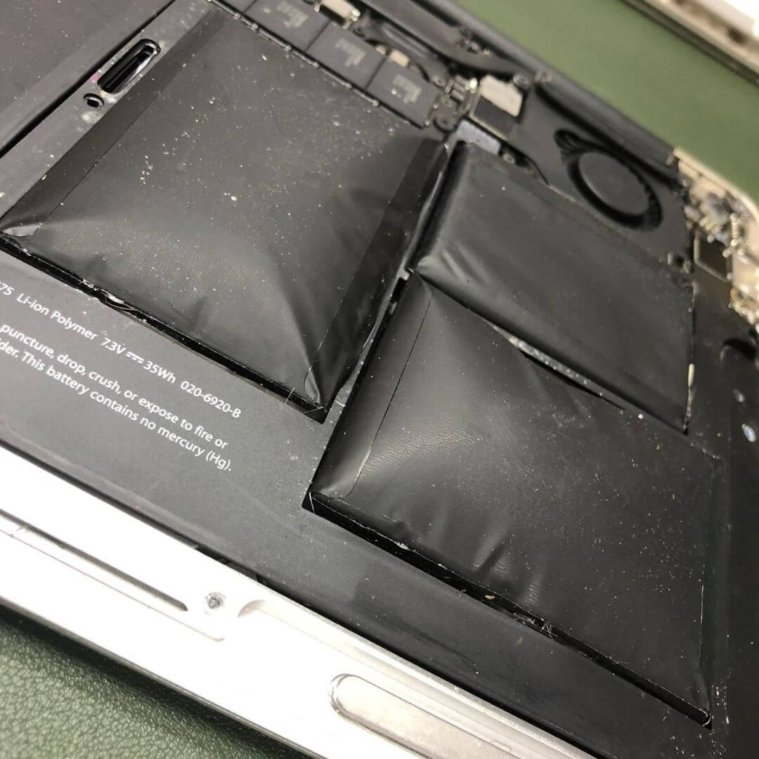 Before: swollen tablet battery